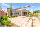 Backyard with desert landscaping featuring a pergola covered sitting area with red tile at 2 Lago Turchino Ct, Henderson, NV 89011