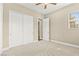 Carpeted bedroom with a large closet and exterior-view window at 2 Lago Turchino Ct, Henderson, NV 89011