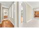 Inviting hallway features hardwood floors, recessed lighting, and seamless flow into the kitchen and bathroom at 2 Lago Turchino Ct, Henderson, NV 89011