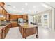 Gourmet kitchen featuring a center island, custom cabinets, stainless appliances, and tile backsplash at 2 Lago Turchino Ct, Henderson, NV 89011