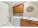 Laundry room featuring cabinets, sink, and appliances for convenience at 2 Lago Turchino Ct, Henderson, NV 89011
