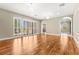 Spacious living room with wood floors, plantation shutters, and elegant lighting fixtures at 2 Lago Turchino Ct, Henderson, NV 89011