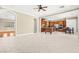 Open-concept living space with tile floors, dining area, and gourmet kitchen with stainless appliances at 2 Lago Turchino Ct, Henderson, NV 89011