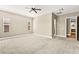Spacious bedroom features a ceiling fan, neutral paint, and carpeted flooring at 2 Lago Turchino Ct, Henderson, NV 89011