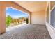 Covered patio featuring brick flooring with desert landscaping outside the archway at 2 Lago Turchino Ct, Henderson, NV 89011