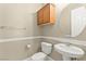 Powder room with pedestal sink, modern toilet, and stylish decor at 2 Lago Turchino Ct, Henderson, NV 89011