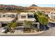 Aerial view of a modern home in a desert community with mountain views at 21 Highland Cove Ln, Henderson, NV 89011
