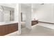 Bright bathroom featuring modern fixtures, dual vanities, sleek tile flooring, and ample counter space at 21 Highland Cove Ln, Henderson, NV 89011