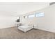 Bright bedroom with a contemporary platform bed, minimalist decor, and ample natural light at 21 Highland Cove Ln, Henderson, NV 89011