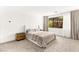 Cozy bedroom with neutral tones, plush bedding, a large window, and minimalist decor at 21 Highland Cove Ln, Henderson, NV 89011