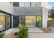 Welcoming home entrance with landscaped garden, offering views of a bright, open living space at 21 Highland Cove Ln, Henderson, NV 89011