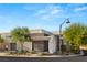 Modern home featuring clean lines, neutral tones, and desert landscaping for a sleek, contemporary look at 21 Highland Cove Ln, Henderson, NV 89011