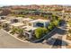 Modern, flat-roof homes in a desert community are surrounded by lush landscaping at 21 Highland Cove Ln, Henderson, NV 89011