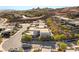 Modern homes in the desert are surrounded by desert landscaping and stunning mountain views at 21 Highland Cove Ln, Henderson, NV 89011