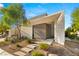 Contemporary home exterior with minimalist landscaping and stone pathway, perfect for a modern aesthetic at 21 Highland Cove Ln, Henderson, NV 89011