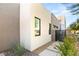 Stylish home exterior with clean design and stone accents, creating an inviting and modern entrance at 21 Highland Cove Ln, Henderson, NV 89011