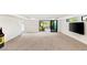 Spacious game room featuring an arcade machine, and sliding doors that lead to a patio at 21 Highland Cove Ln, Henderson, NV 89011
