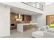 Modern kitchen featuring stainless steel appliances, a waterfall island, and an open layout at 21 Highland Cove Ln, Henderson, NV 89011