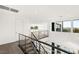 Open landing area with modern railings, bright lighting, and views of the lower level at 21 Highland Cove Ln, Henderson, NV 89011