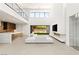 Elegant living room with open-concept design, modern fireplace, and seamless access to outdoor space at 21 Highland Cove Ln, Henderson, NV 89011