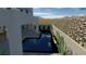 Rendering of an outdoor lounge area with pool, fireplace, stone wall, and desert plants at 21 Highland Cove Ln, Henderson, NV 89011