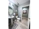Chic bathroom with a pedestal sink, toilet, and gray accents for a modern look at 23 E Agate Ave # 301, Las Vegas, NV 89123