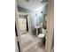 Cozy bathroom featuring a pedestal sink, toilet, tub-shower combo, and stylish decor at 23 E Agate Ave # 301, Las Vegas, NV 89123