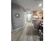 Hallway view of the kitchen and entrance, enhanced by neutral tones and modern finishes at 23 E Agate Ave # 301, Las Vegas, NV 89123