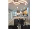 Open-concept kitchen with granite countertops, stainless appliances, and barstool seating at 23 E Agate Ave # 301, Las Vegas, NV 89123