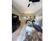 Well-lit living room featuring modern decor, tile flooring, and an open floor plan at 23 E Agate Ave # 301, Las Vegas, NV 89123