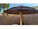 Backyard featuring a Tiki hut, perfect for outdoor entertaining and shaded relaxation at 23 Indian Run Way, Las Vegas, NV 89148