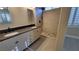 Modern bathroom with dual vanity, granite countertop, walk-in shower, and tiled floor at 23 Indian Run Way, Las Vegas, NV 89148