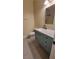 Bathroom featuring a vanity sink, ample storage, and neutral colored walls at 23 Indian Run Way, Las Vegas, NV 89148