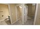 Hallway view with a bathroom to the left and multiple rooms ahead at 23 Indian Run Way, Las Vegas, NV 89148