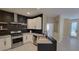 Modern kitchen features stainless steel appliances, dark accent wall and ample counter space at 23 Indian Run Way, Las Vegas, NV 89148