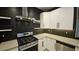 Close up of kitchen features stainless steel appliances and plenty of storage space at 23 Indian Run Way, Las Vegas, NV 89148