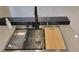 New stainless steel kitchen sink with restaurant style faucet and accessories at 23 Indian Run Way, Las Vegas, NV 89148