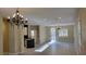 Open floorplan with modern lighting, light walls, and hardwood flooring at 23 Indian Run Way, Las Vegas, NV 89148