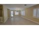 Bright living room features neutral color scheme, hardwood floors, recessed and chandelier lighting at 23 Indian Run Way, Las Vegas, NV 89148