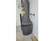 Utility room shows water heater and water softener system at 23 Indian Run Way, Las Vegas, NV 89148