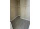 Empty walk-in closet with wood-look floors and wire shelving at 23 Indian Run Way, Las Vegas, NV 89148