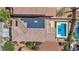 Aerial view of a home with solar panels and a pool at 2449 Daks Loden Ct, Henderson, NV 89044