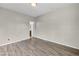 Spacious bedroom with wood floors featuring a bathroom ensuite at 2449 Daks Loden Ct, Henderson, NV 89044