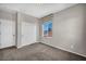Bright bedroom featuring a window, closet, and plush carpeting at 2449 Daks Loden Ct, Henderson, NV 89044