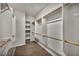 Walk-in closet features custom wood shelving and ample storage space at 2449 Daks Loden Ct, Henderson, NV 89044