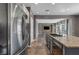 Well-appointed kitchen with stainless steel appliances and a view of the living room at 2449 Daks Loden Ct, Henderson, NV 89044