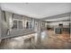 Open-concept living room features hardwood floors, leads into a bright kitchen, and view of backyard at 2449 Daks Loden Ct, Henderson, NV 89044