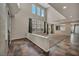 Bright living room featuring soaring ceilings, large windows, and unique tile flooring at 2449 Daks Loden Ct, Henderson, NV 89044
