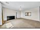 Spacious primary bedroom with plush carpet, designer chandelier, and ample natural light at 2449 Daks Loden Ct, Henderson, NV 89044