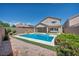 Beautiful backyard with sparkling pool and spa, enhanced with mature landscaping at 2449 Daks Loden Ct, Henderson, NV 89044
